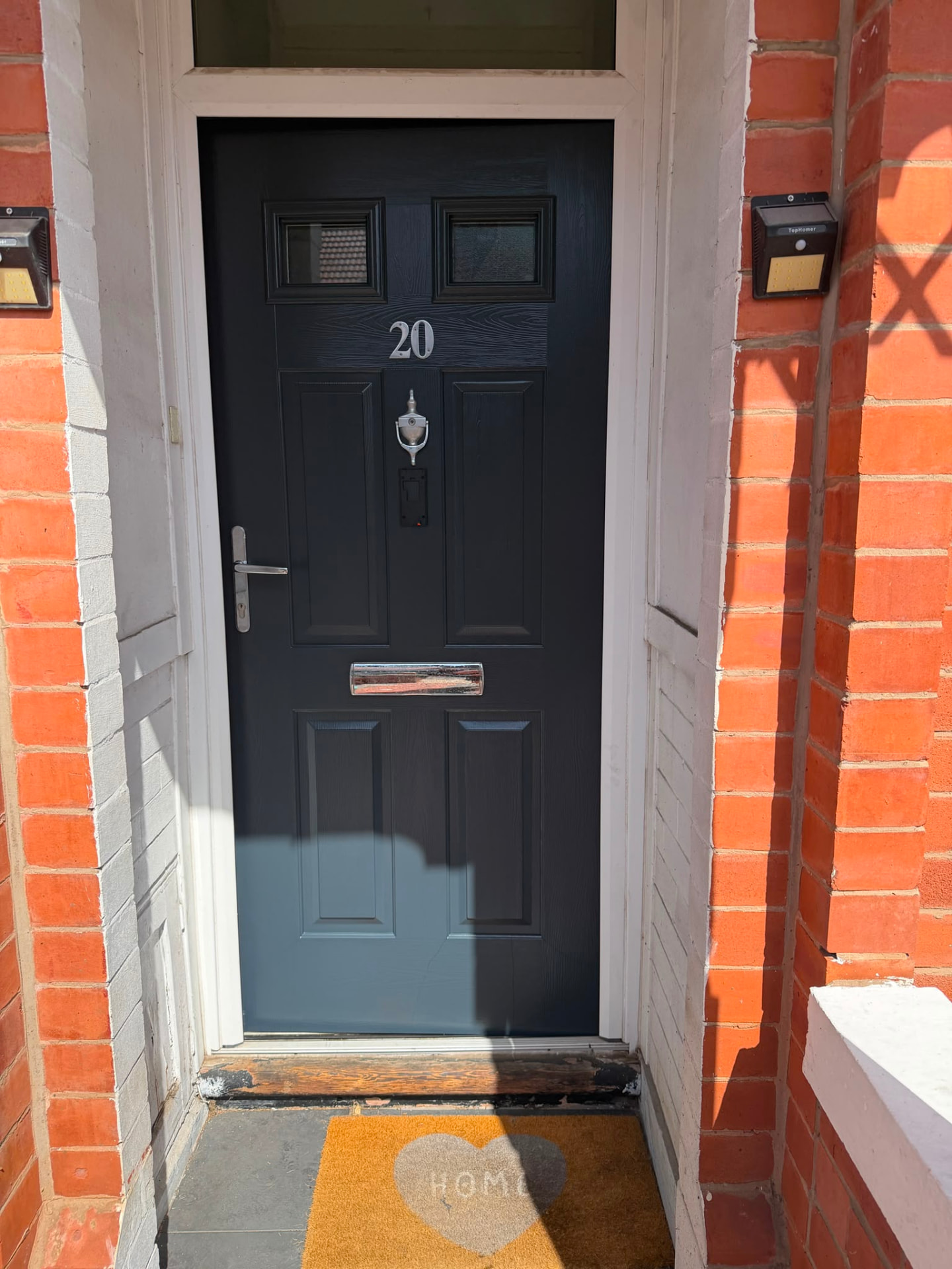 Composite front door resprayed in a deep anthracite finish.